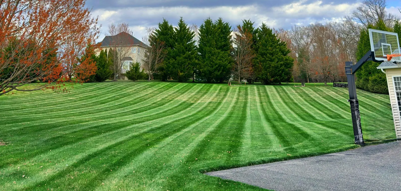 Freshly mowed striped backyard lawn at a customer's home in Harford County, MD